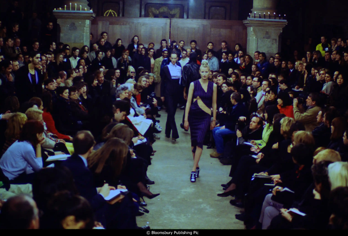 Models walking down the runway in a fashion show