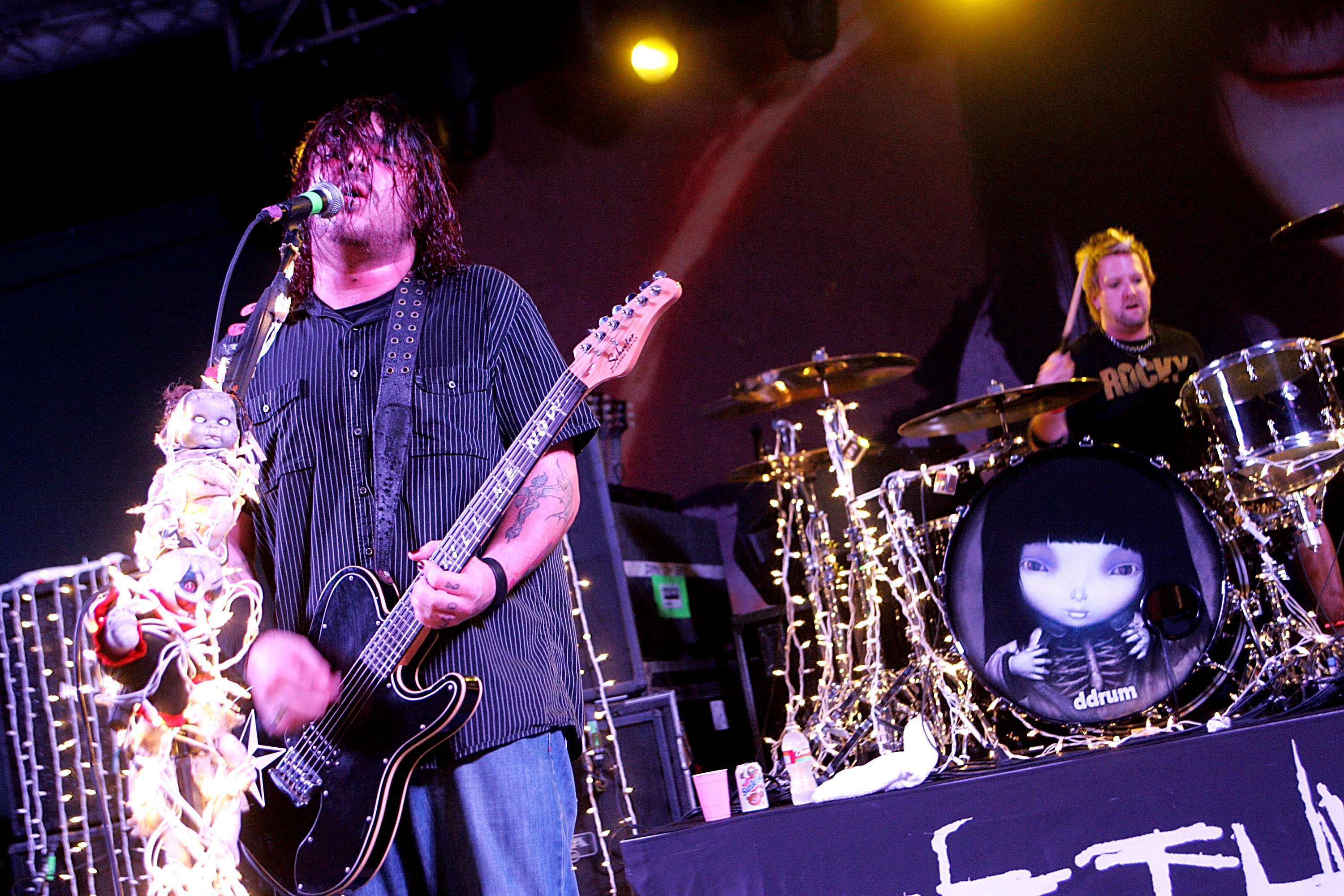 A photo of South African metal band Seether performing on stage in 2008 in Austin, Texas.