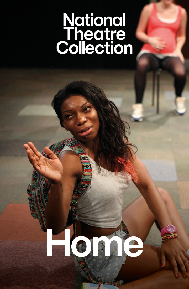 An actress sat on a chair singing starring in Home directed by Nadia Fall, a production recorded for the National Theatre