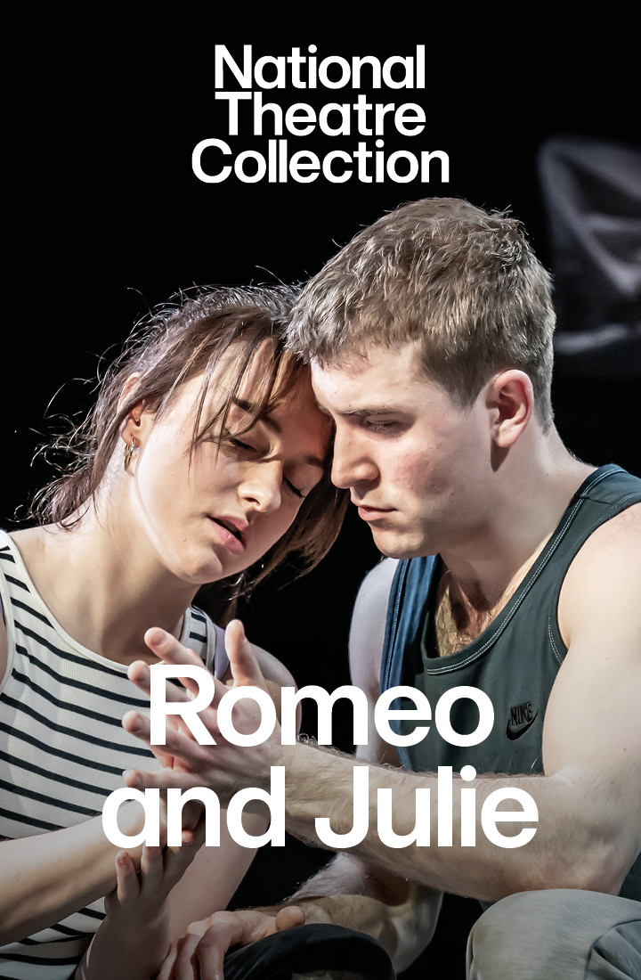 A young woman in a striped t-shirt entwines hands with a young man