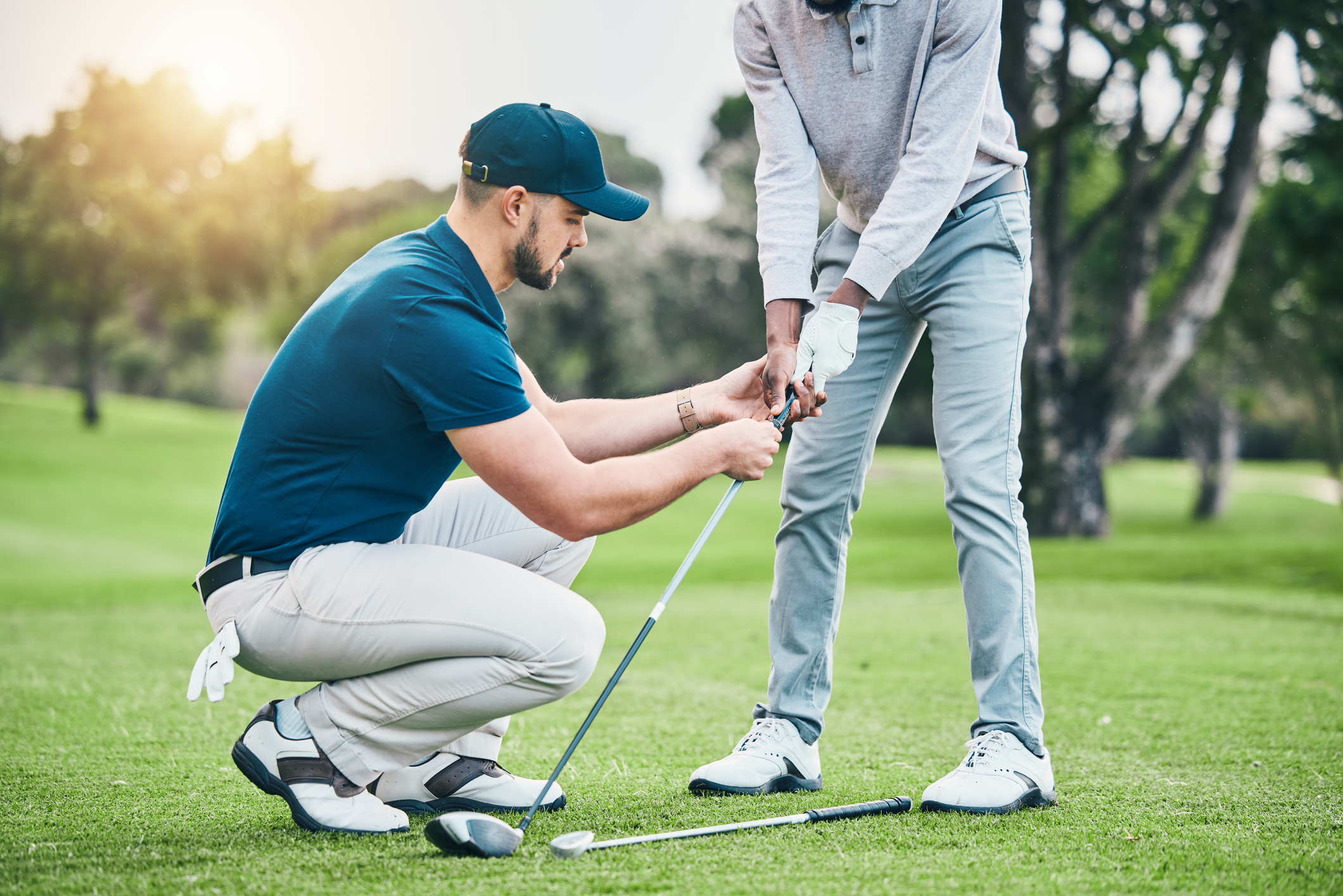 man teaching golf