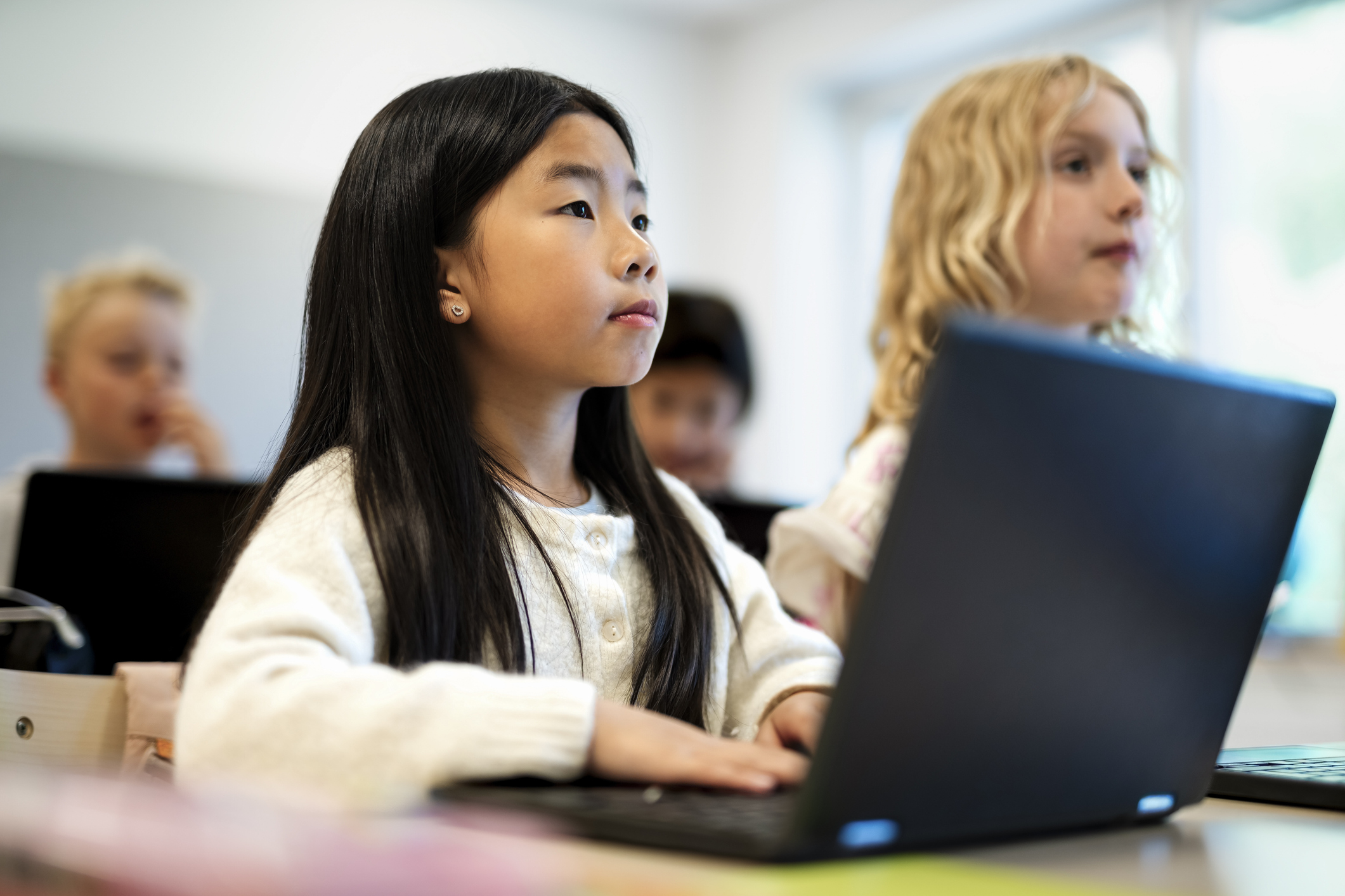 Photo of students at laptops 