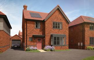 A red brick house with solar panels on the roof sits in the foreground, while other similar houses and a clear blue sky form the background.