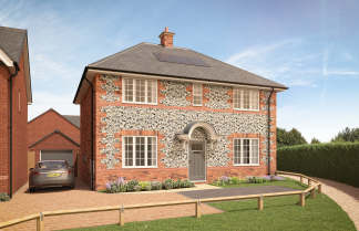 A charming two-story brick house with a patterned exterior, surrounded by a grassy lawn and a paved driveway leading to the front entrance.