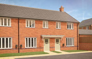 Two identical brick townhouses with white-framed windows and light green doors stand on a paved walkway with a manicured lawn in front, while a cloudy blue sky stretches above.