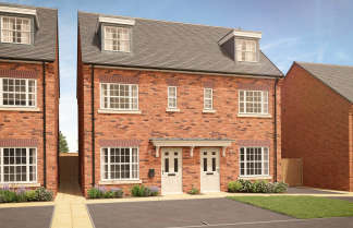 A pair of red brick semi-detached houses with white doors and windows stand on a paved driveway in front of a clear blue sky.
