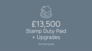 A white line drawing of a house sits above large white text stating "£13,500 Stamp Duty Paid + Upgrades" on a muted blue background with smaller white text below reading "On this home".