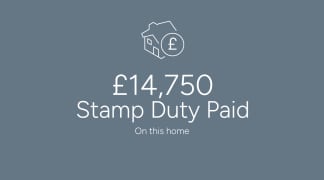 The image displays a house icon and the text "£14,750 Stamp Duty Paid" on a gray background, indicating the amount of stamp duty paid for the home.