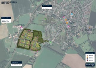 A new housing development is shown in the foreground, with a village and surrounding countryside in the background.