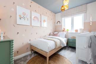 A cozy and whimsical bedroom with floral wall decor, a wooden bed frame, and a green dresser, creating a warm and inviting atmosphere.