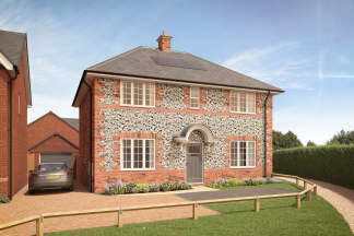 A charming two-story brick house with a patterned exterior, surrounded by a grassy lawn and a paved driveway leading to the front entrance.
