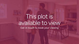 A couple stands in a modern kitchen and dining area, with text overlaying the image stating "This plot is available to view. Get in touch book your viewing."