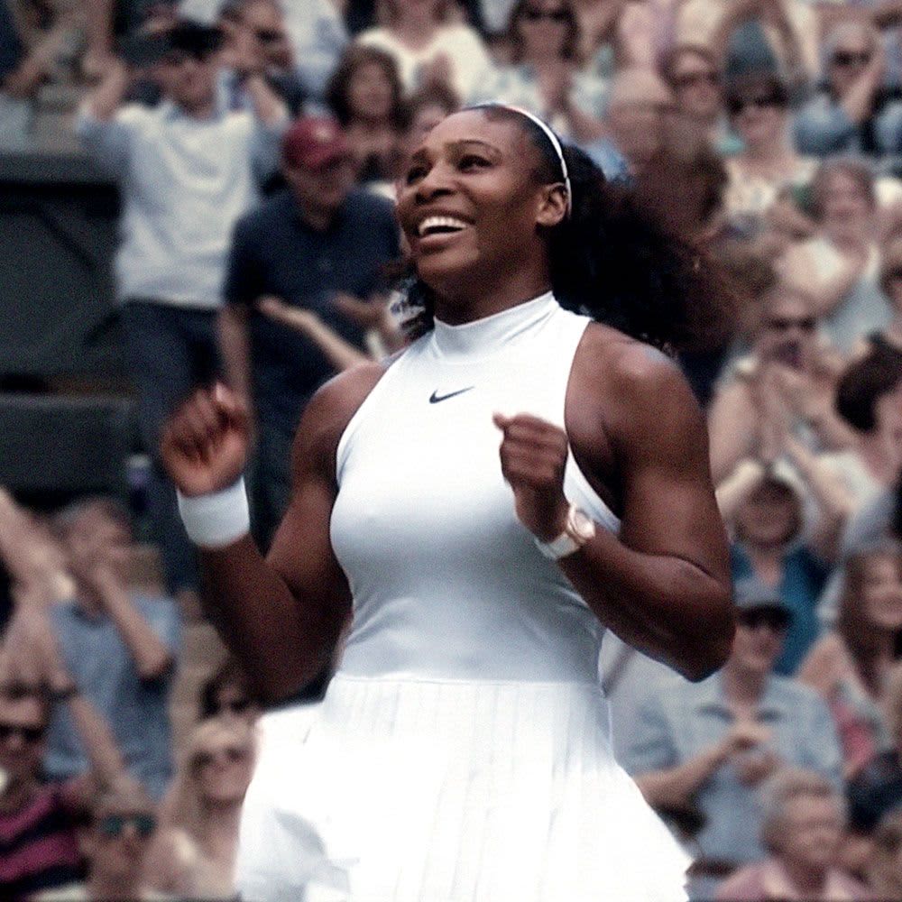 Serena Williams smiling after winning a tennis match