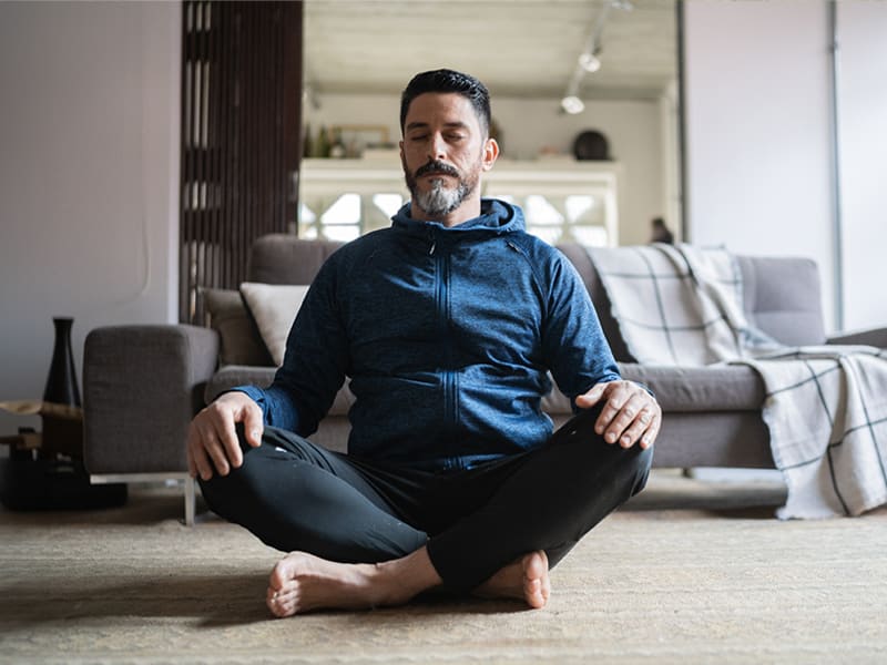 man in a seated yoga pose