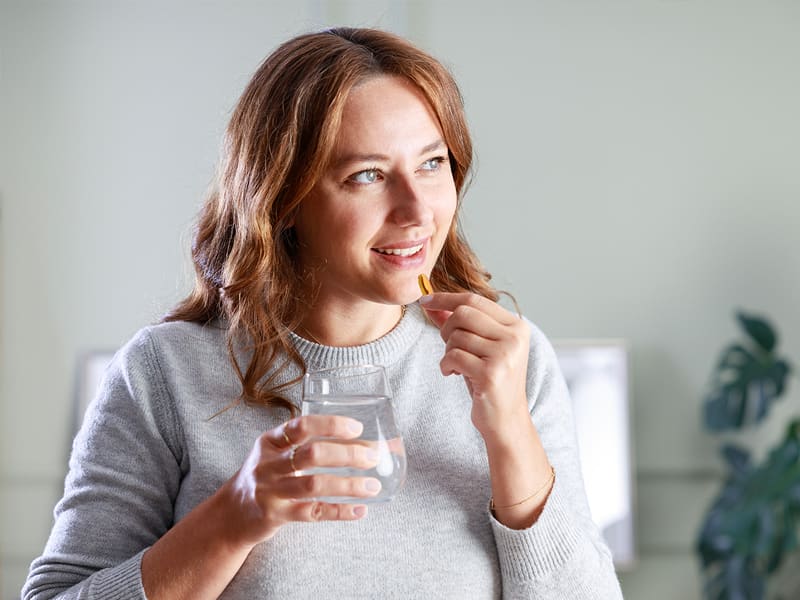 woman taking medication