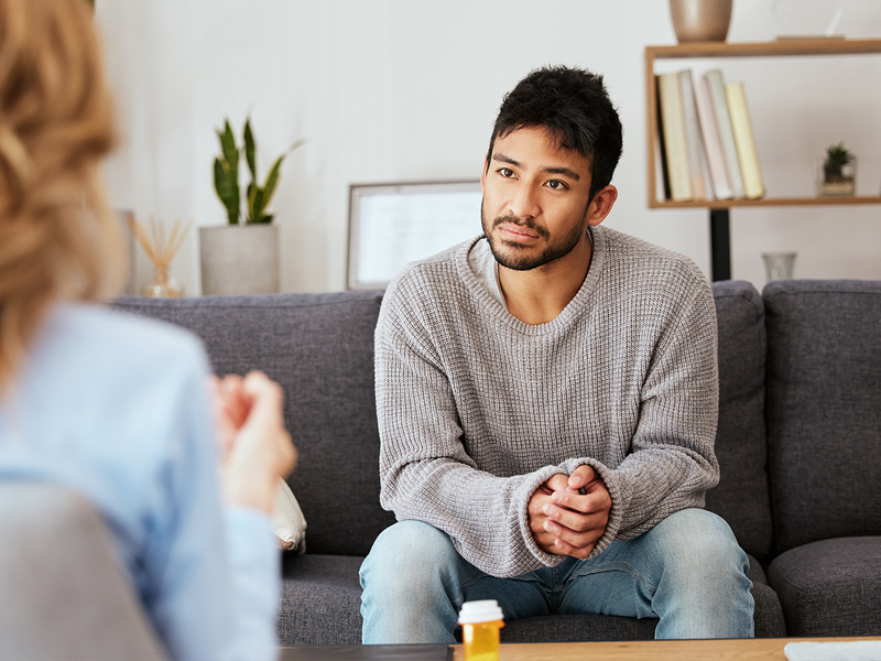 man talking to a doctor