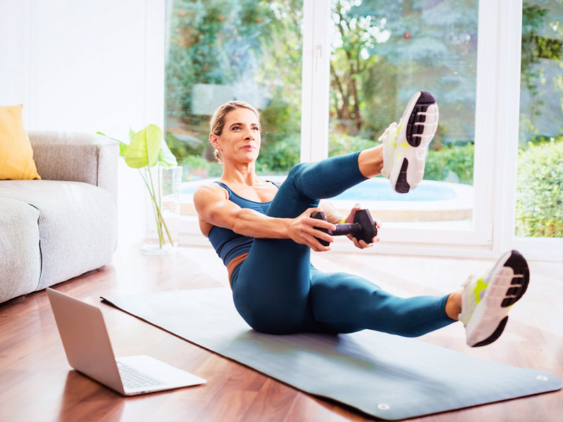 woman exercising on a yoga mat