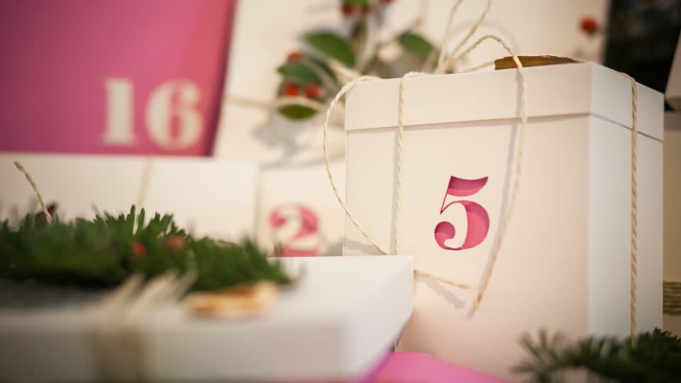 festive decorative boxes with calendar dates on them