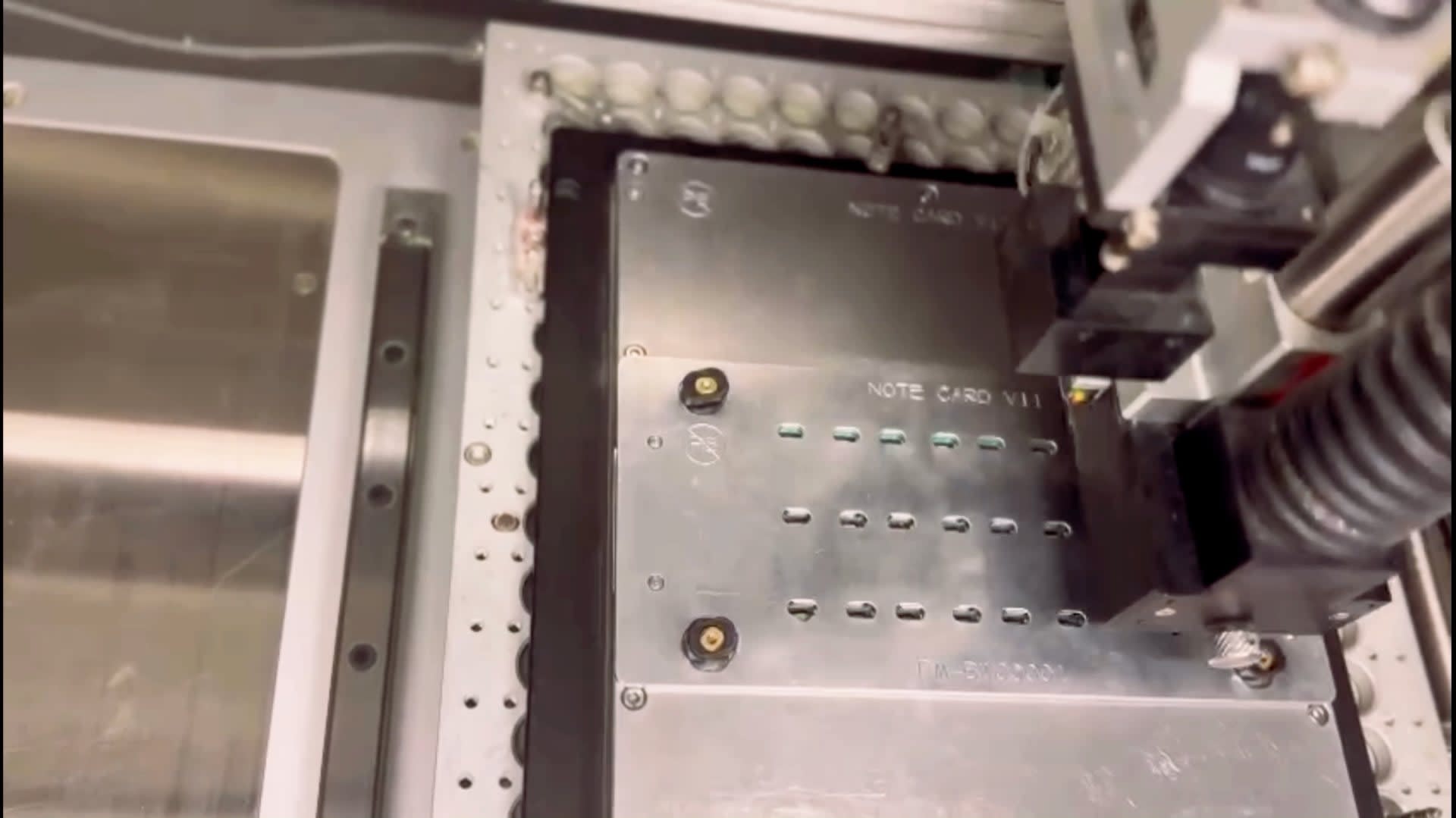 The fixture ensures the router cannot damage components or cut the wrong part of the PCB panel.