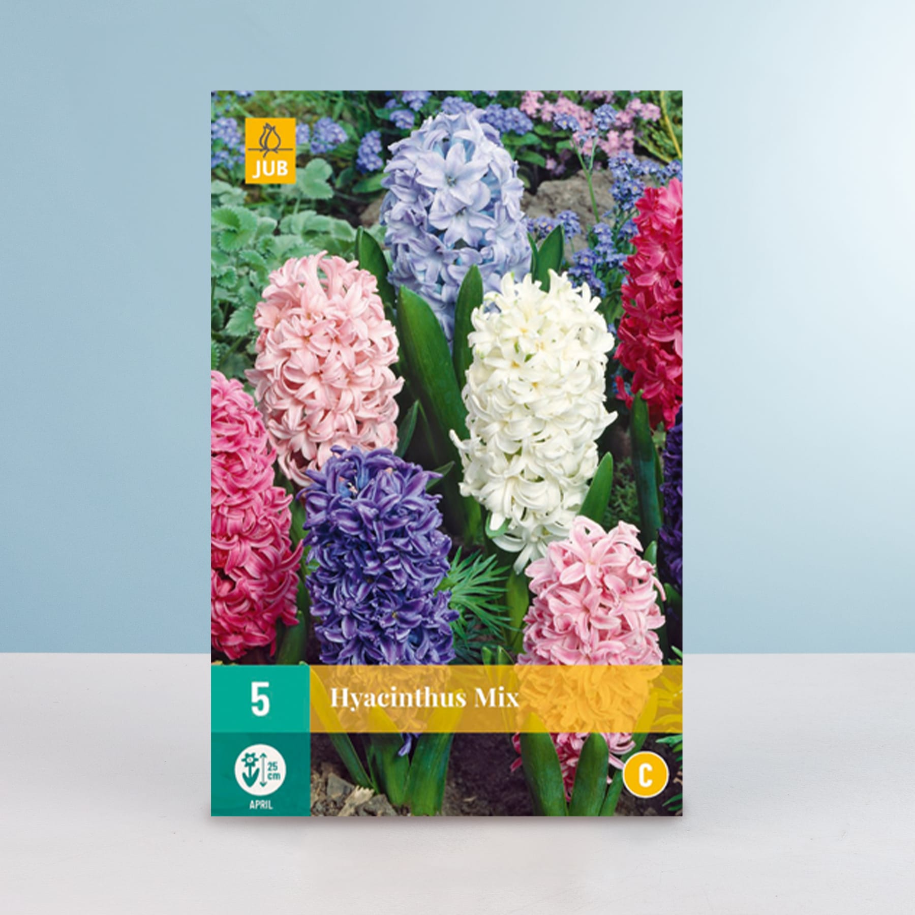 Das Bild zeigt eine leuchtende Palette von Hyazinthenblüten in verschiedenen Rosa-, Weiß- und Lilatönen vor einem üppigen, grünen Hintergrund.