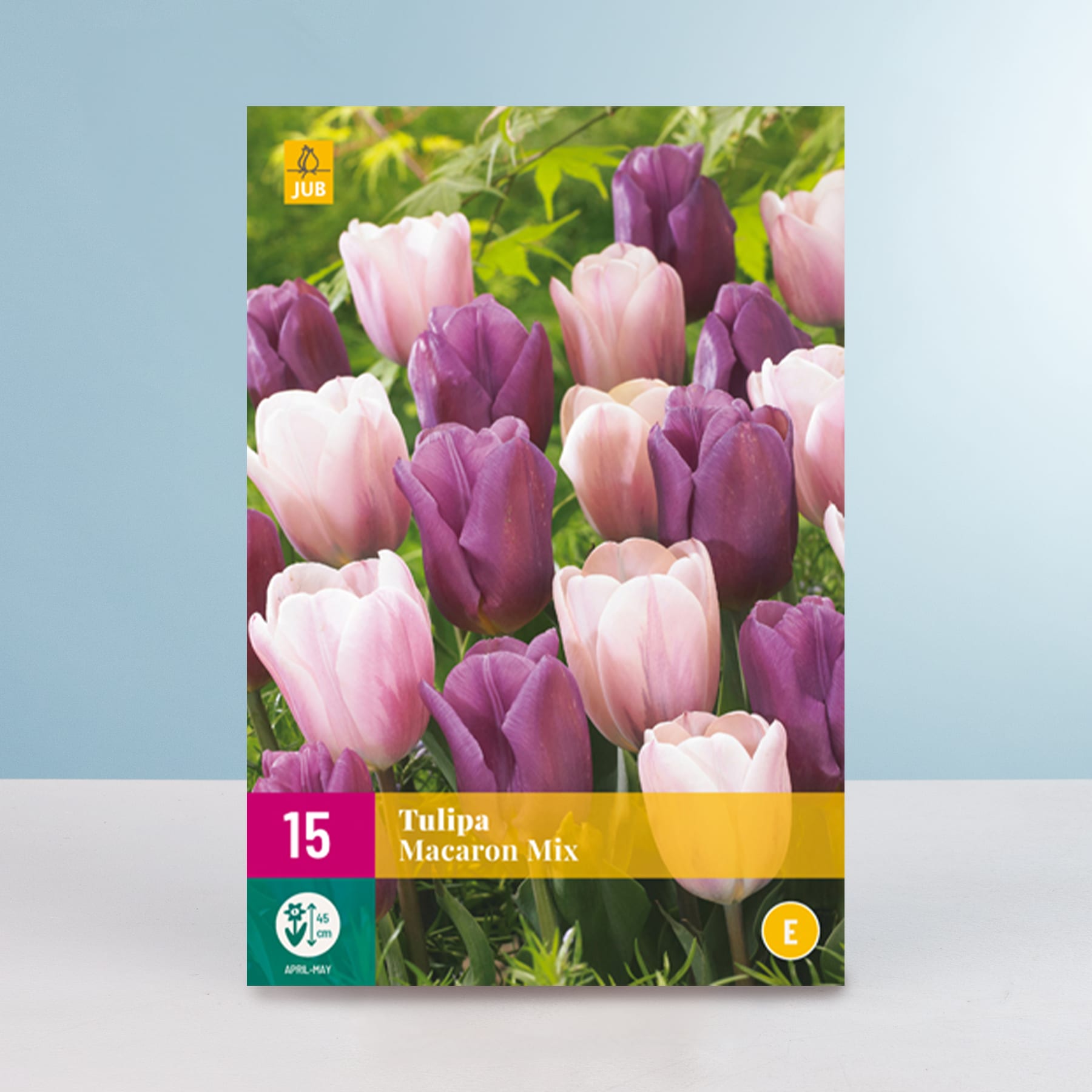 Eine leuchtende Darstellung rosa und violetter Tulpen vor einem verschwommenen grünen Laubhintergrund, mit einem prominent im Vordergrund abgebildeten Produktetikett.