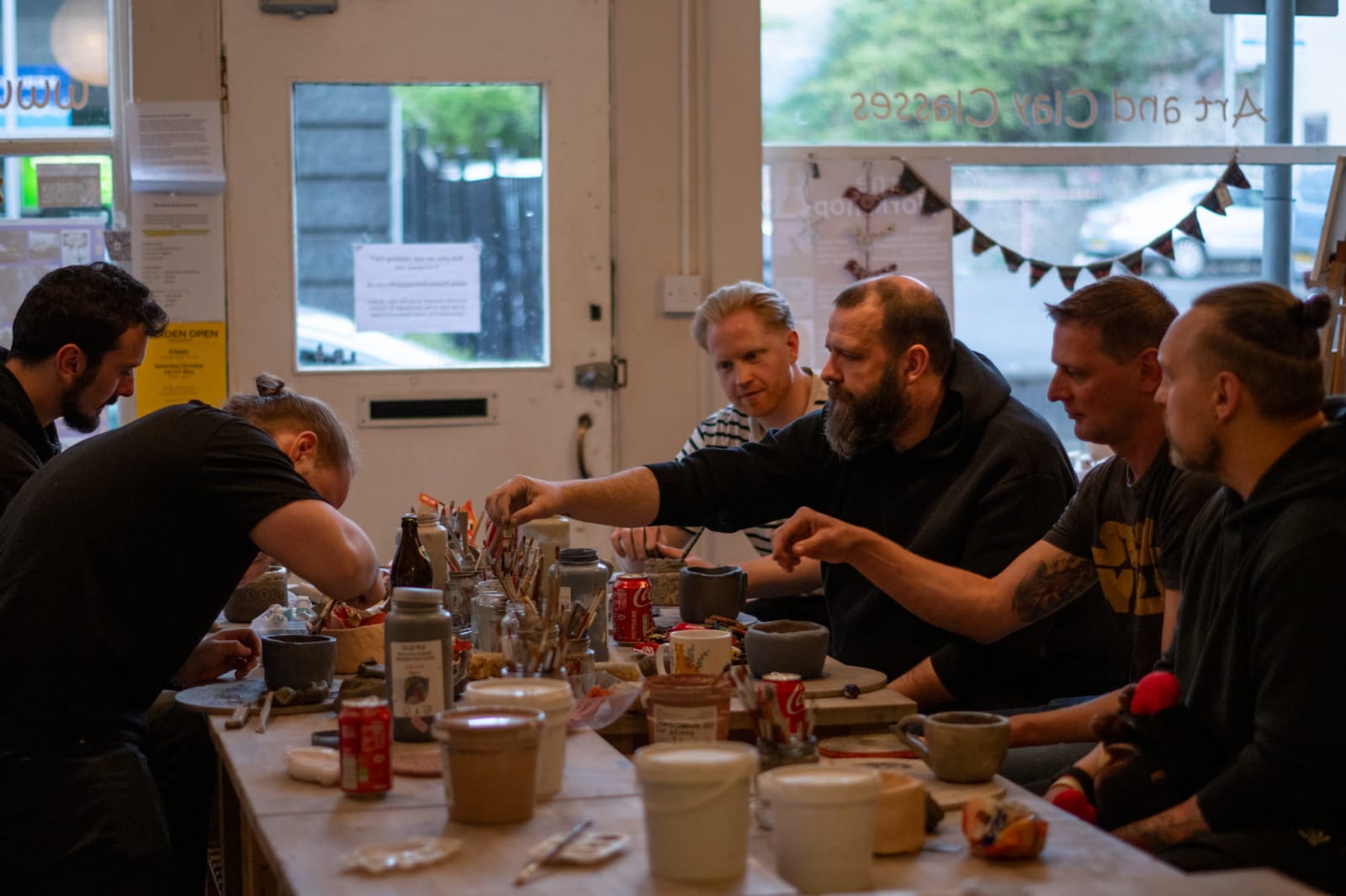 Guests creating clay pieces at a teambuilding session, 1 of 4