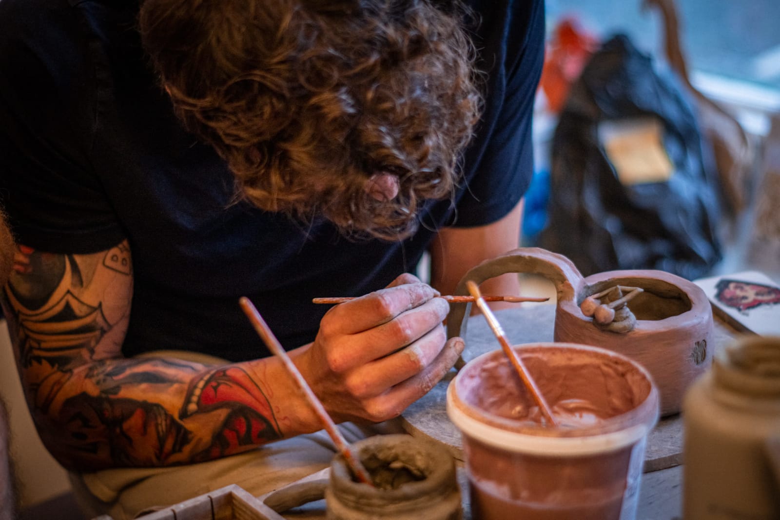 Guests creating clay pieces at a teambuilding session, 2 of 4