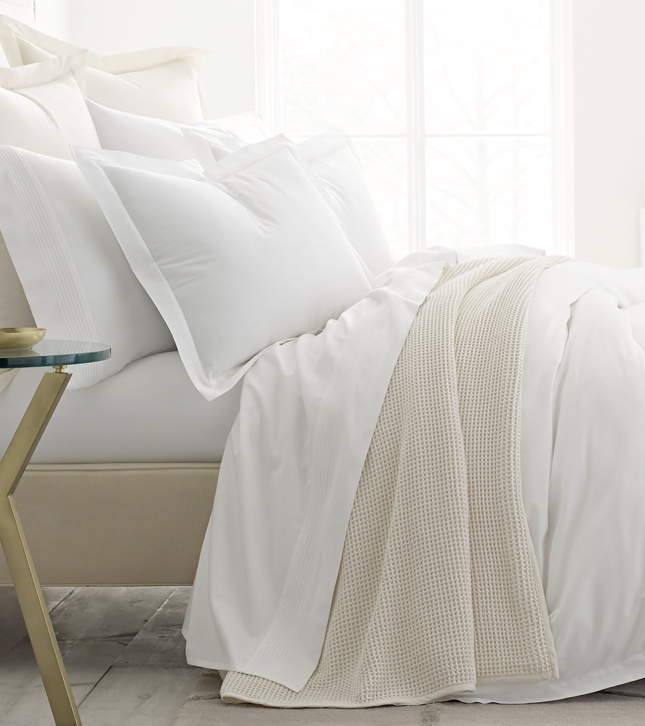 Side profile bed with white sheets
