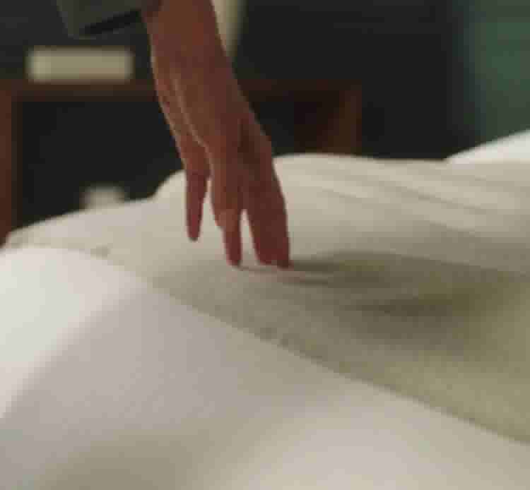 video background image - Hands brushing over throw