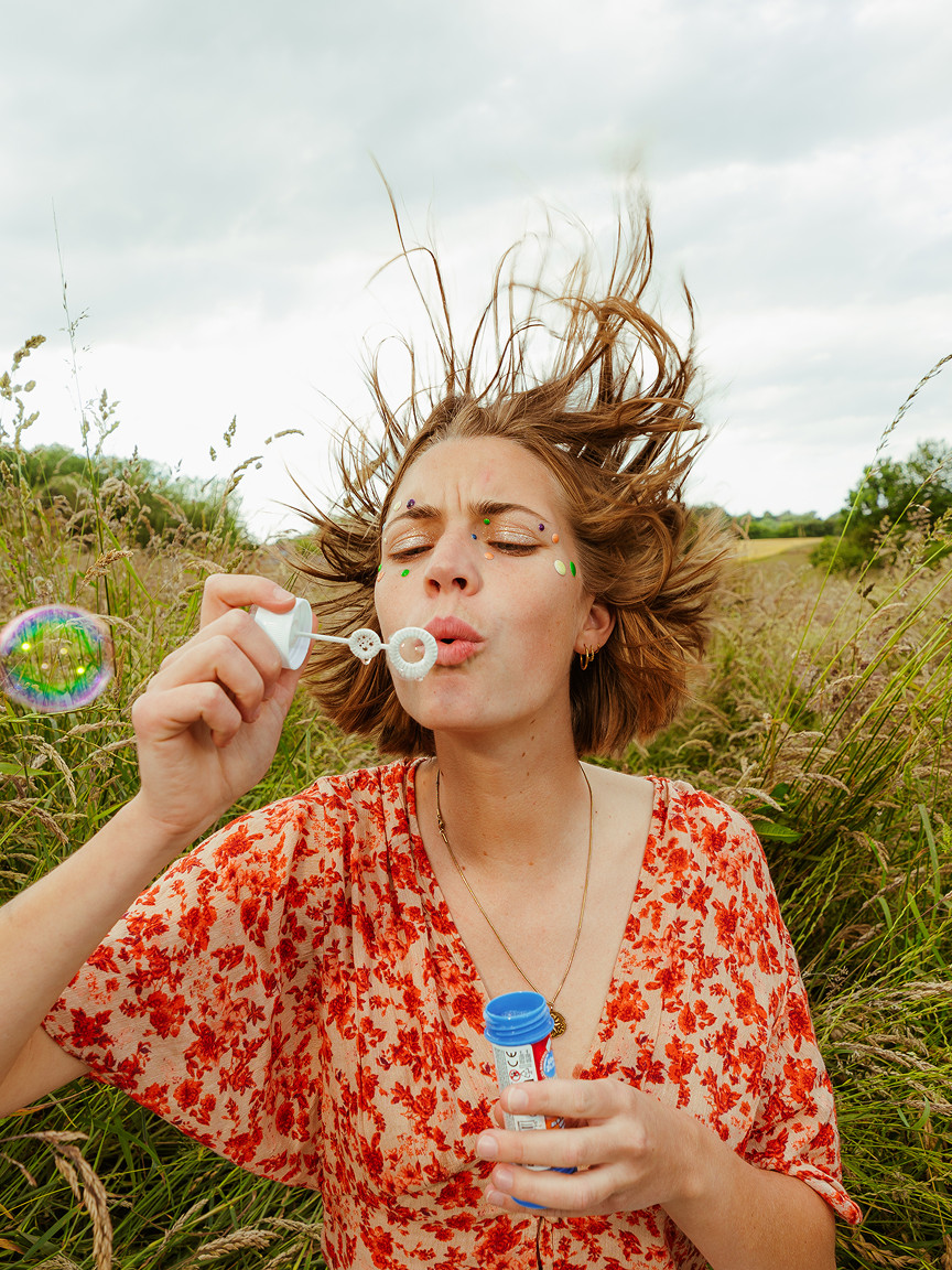 Woman blowing bubbles