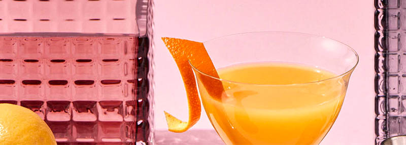 Een fruitige en oranje gin cocktail maken? Check het recept.