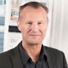 En profilbild av fastighetsmäklare Jens Pelland