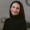 En profilbild av fastighetsmäklare Johanna Berggren