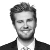 En profilbild av fastighetsmäklare Alexander Schöllin
