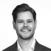 En profilbild av fastighetsmäklare Fredrik Lindberg