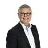 En profilbild av fastighetsmäklare Robert Lundin