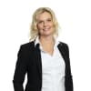 En profilbild av fastighetsmäklare Anna Borgudd