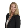 En profilbild av fastighetsmäklare Linda Olin