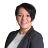En profilbild av fastighetsmäklare Annica Bruksås