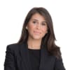 En profilbild av fastighetsmäklare Amanda Barsoum Eklund