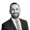 En profilbild av fastighetsmäklare Alexander Lahdo