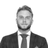 En profilbild av fastighetsmäklare Alexander Torssell
