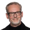 En profilbild av fastighetsmäklare Bengt Garp