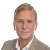 En profilbild av fastighetsmäklare Henrik Hansson