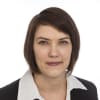 En profilbild av fastighetsmäklare Malin Bergström