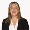 En profilbild av fastighetsmäklare Ida Brandt