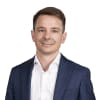 En profilbild av fastighetsmäklare Erik Wallström