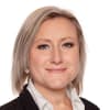 En profilbild av fastighetsmäklare Anna Melefors