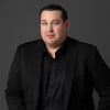 En profilbild av fastighetsmäklare Alexander Wall