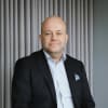 En profilbild av fastighetsmäklare Björn Olsson